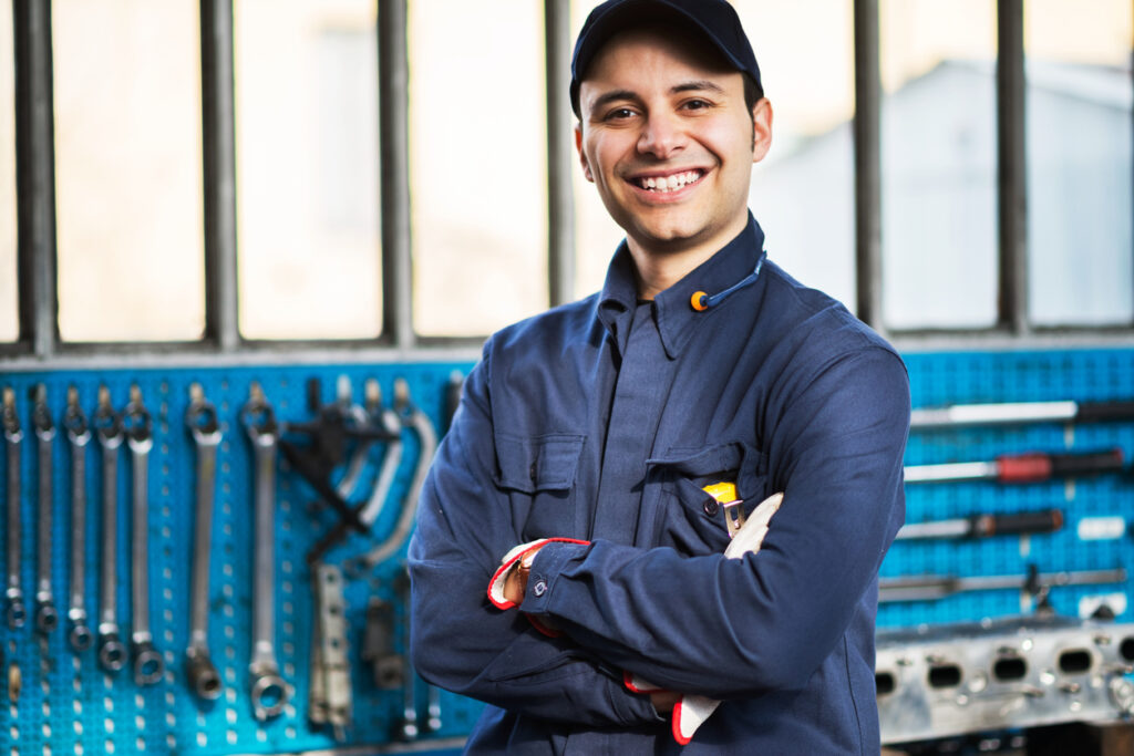 Portrait of a worker in front of his tools